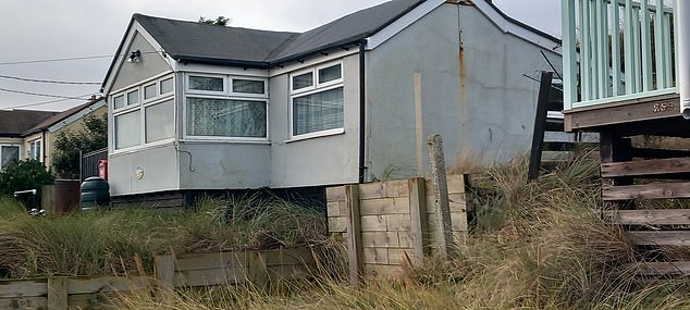 His house (pictured) on the Norfolk coast had to be demolished by the council due to the risk of sea erosion