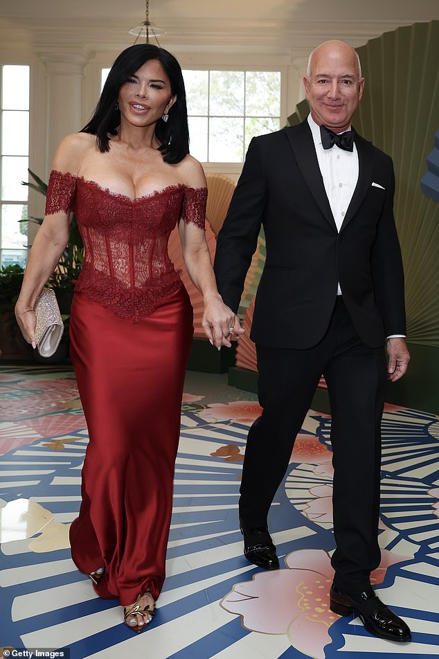 Bezos looked dapper in a black tuxedo as they headed inside to join the likes of Robert De Niro as part of President Biden's state dinner for the Japanese Prime Minister