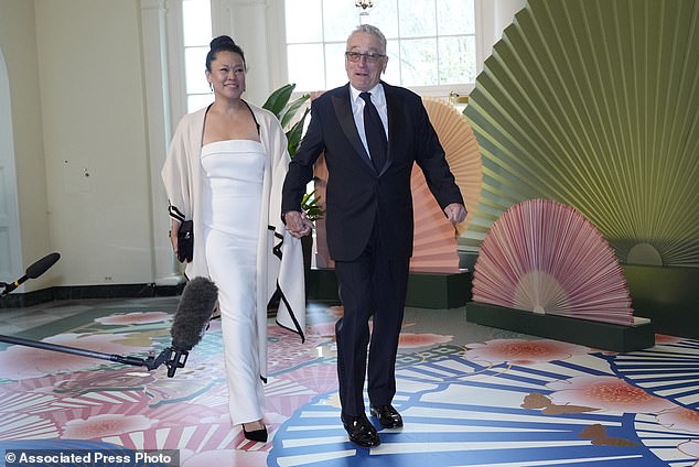 Robert De Niro and Tiffany Chen arrive in the White House booksellers' room for the state dinner