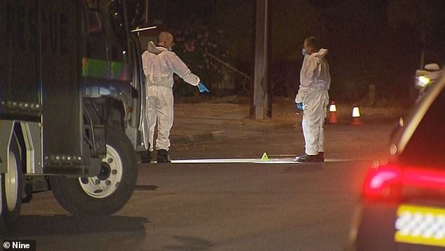 Terrifying CCTV footage shows Mr Holdback screaming for help as he was chased by his attackers (Picture: Forensic officers at the murder scene)