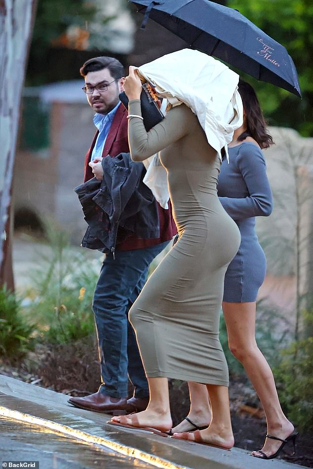 Pictured: Bruce Lehrmann and two women leave his North Sydney home on Tuesday