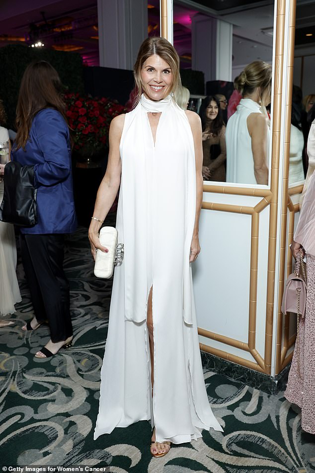 The Full House actress was dressed in a long white henna dress with a scarf at the Hollywood fundraiser, with open-toe sandals