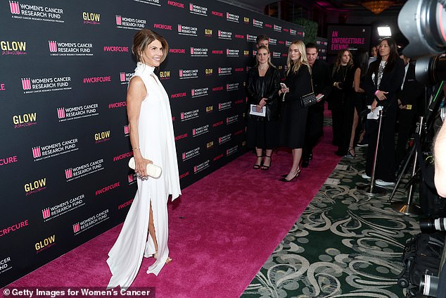 The actress posed for photographers on the red carpet at the charity event in Southern California