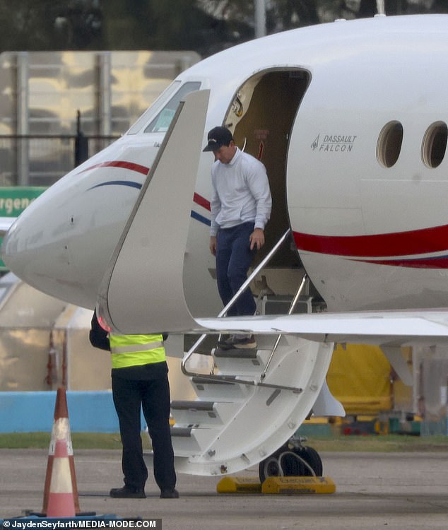 The actor was spotted landing in the New South Wales capital on his private jet looking relaxed and content after a day out on the greens