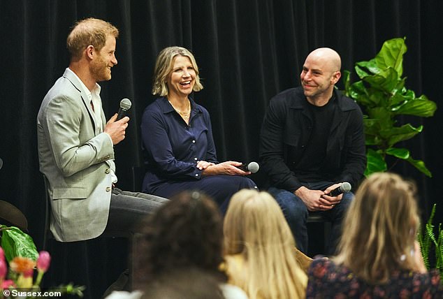 Prince Harry speaks yesterday with Kelly Jones of Cisco and Dr.  Adam Grant of BetterUp