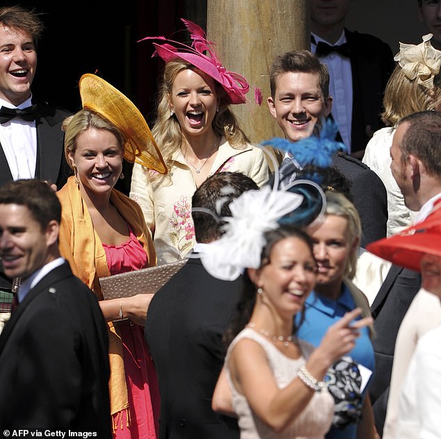 Lindsay was pictured smiling and cheering (dressed at the back in a cream top and pink hat) at Zara's wedding to rugby star Mike Tindall in 2011.