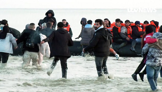 1712832048 769 Moment British funded French police watch as dozens of migrants sprint