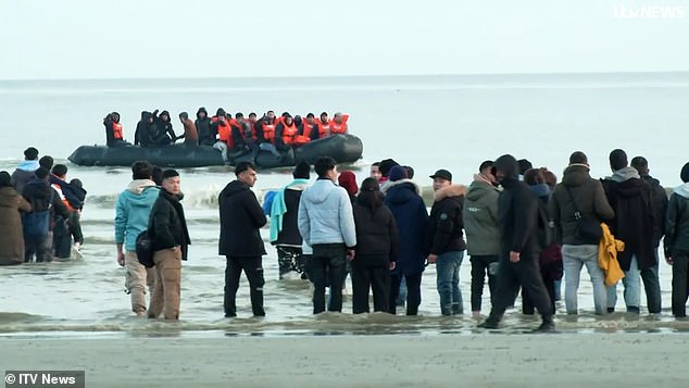 Dozens of migrants waited for the ship to return before climbing aboard, causing the dinghy to become dangerously overcrowded