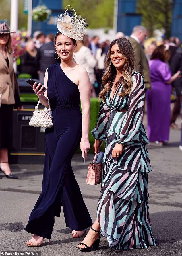 Double trouble!  These fashionable friends looked excited to be heading to the races at Liverpool's Aintree Racecourse today