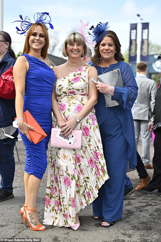 Three times as much fun!  These beautiful racegoers were clearly dressed to impress with their high heels and flattering dresses