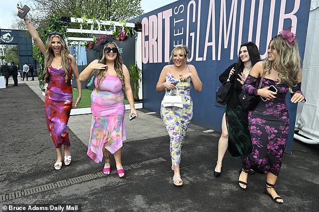 Here come the girls!  A group of friends looked ready to enjoy their day off as they strutted their stuff in glamorous dresses