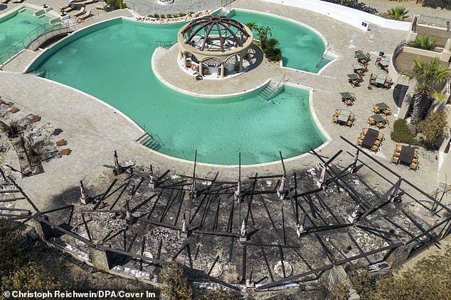 Sun loungers and a pool bar at a hotel destroyed by fire in the southeast of the holiday island of Rhodes