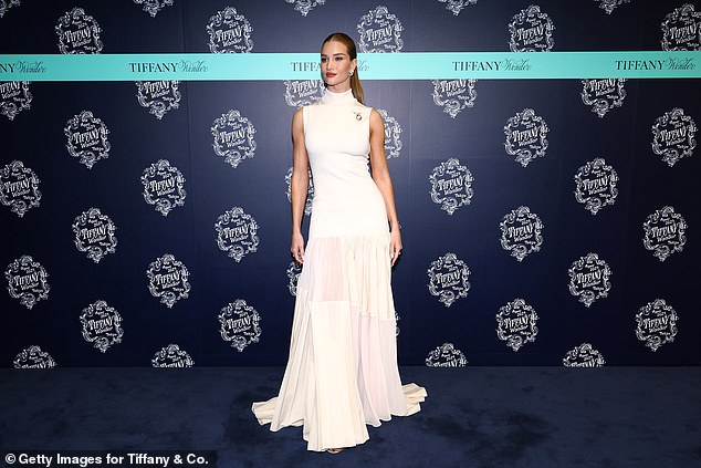 The model showed off her stunning physique in her glamorous white dress