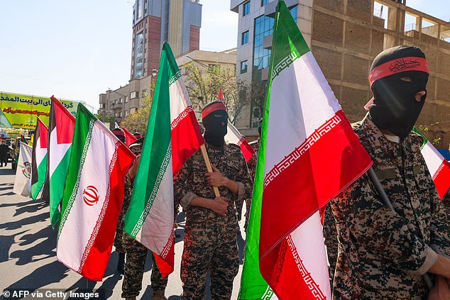 Iranian soldiers attend the funeral procession for seven members of the Islamic Revolutionary Guards Corps killed in an attack in Syria, which Iran blamed on Israel, in Tehran on April 5, 2024