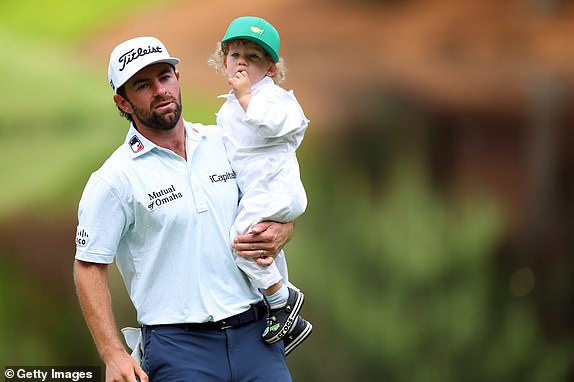 AUGUSTA, GEORGIA - APRIL 10: Cameron Young of the United States holds his son, Henry, on the ninth green during the Par Three Contest prior to the 2024 Masters Tournament at Augusta National Golf Club on April 10, 2024 in Augusta, Georgia.  (Photo by Andrew Redington/Getty Images)