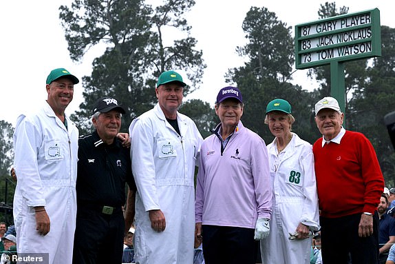 Golf - The Masters - Augusta National Golf Club - Augusta, Georgia, USA - April 6, 2023 Gary Player of South Africa, Tom Watson of the USA and Jack Nicklaus of the USA pose for a photo with their caddies on the first tee during the ceremony starts on the first day of REUTERS/Brian Snyder play