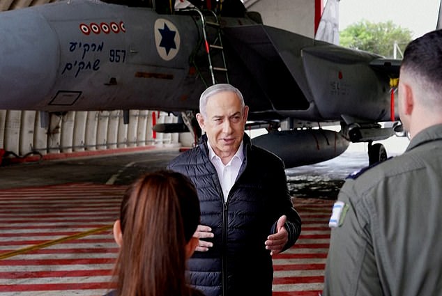 Israeli Prime Minister Benjamin Netanyahu visits an F-15 base on April 11, 2024.  Netanyahu appeared to repeat during the visit that if Iran attacks, Israel will respond with 'anyone who hits us, we hit them'