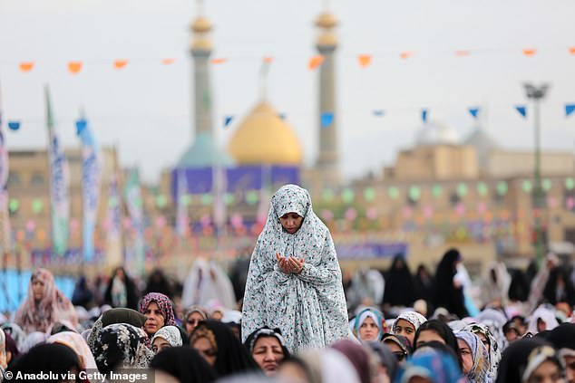 Muslims arrive at the Shah Abdol-Azim Shrine to perform the prayer of Eid al-Fitr that marks the end of the fasting month of Ramadan, one of the holiest months in the Islamic calendar, in Tehran