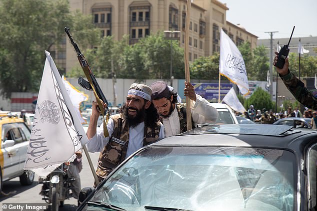 Taliban supporters parade through the streets of Kabul on August 15, 2023