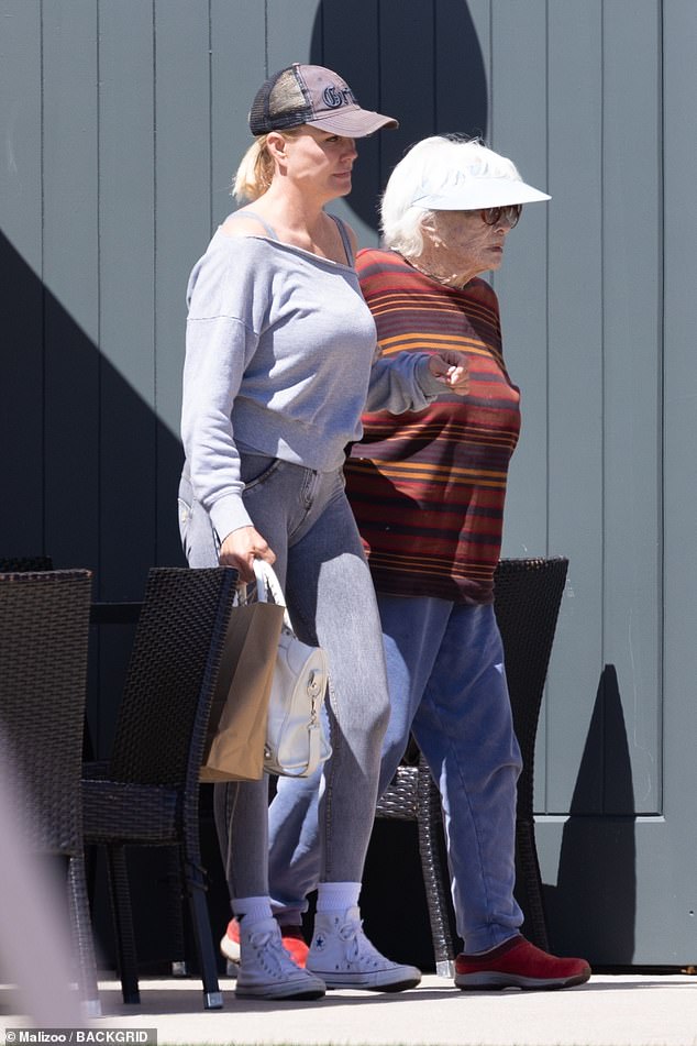 Shirley held the woman's wrist as they walked to their car, but she was still walking on her own two feet.