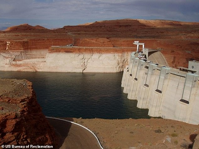 On the Lake Powell side of the Glen Canyon Dam, the hydroelectric dams can be seen above water level.  These inlets, located above the river outlets, feed water to energy turbines.