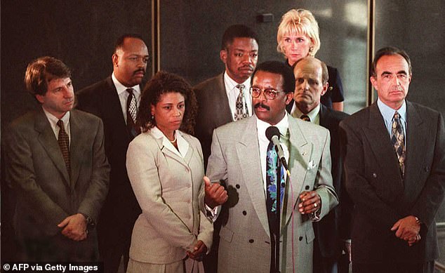 Tensions arose over strategy within the defense team, with Robert Shapiro (far right) maintaining the 'race card' and should not have been played by Johnnie Cochran (speakers centre).