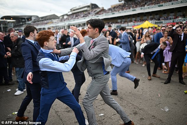 Racegoers clash as they brawl on the second day of the Grand National Festival horse racing meeting at Liverpool's Aintree Racecourse