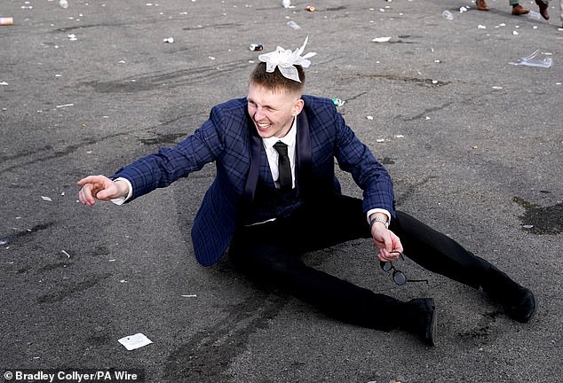 A racegoer at the end of day two of the Liverpool event