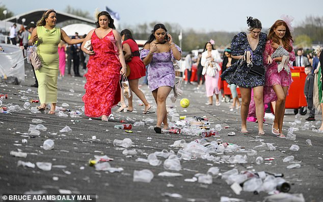 Litter scattered on the ground during Ladies Day at Liverpool's Aintree Racecourse