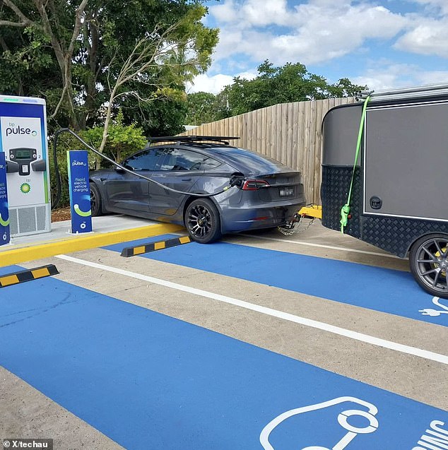 The original image of the Tesla, which had been cropped, resurfaced to reveal the car towing a trailer - highlighting another problem: Australia's EV charging stations are not equipped for cars that tow caravans