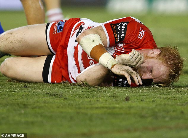 James Graham (pictured, playing for the Dragons) has previously stated that he has suffered at least 100 concussions during his rugby league career and fears he has CTE in his brain, which cannot be diagnosed until after death