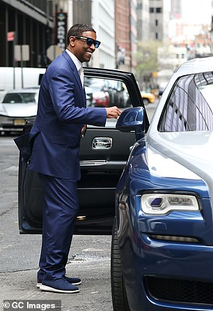 Finally, the old Hollywood leading man gets into the backseat of the car