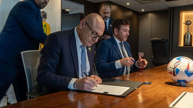 Israel FA chief Moshe Zuares, left, has signed a cooperation agreement with CONMEBOL