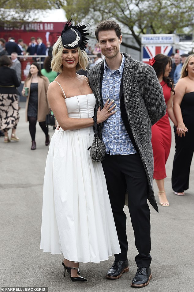 Sarah Jayne was joined by her husband Jonathan Smith, who kept it casual in a patterned shirt and gray tweed jacket