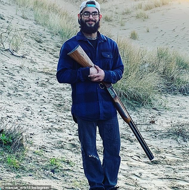 Eriz is seen in a photo on social media with a gun in his hand.  The 27-year-old autoworker's social media accounts are full of photos of him with guns