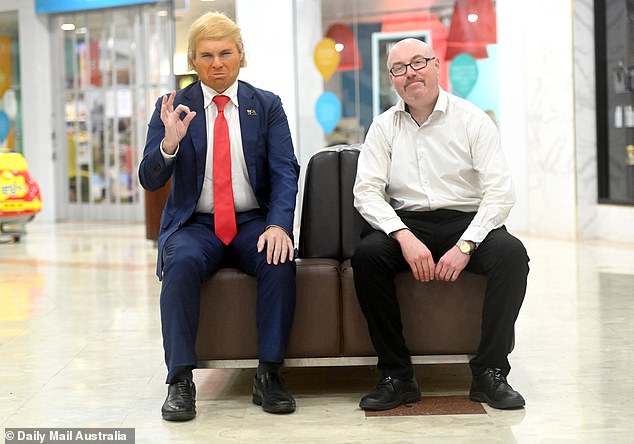 Trump next to a 'fan' in a shopping center in Newcastle