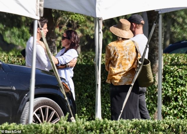 Meghan was seen hugging Nacho Figueras as she took part in husband Prince Harry's shoot