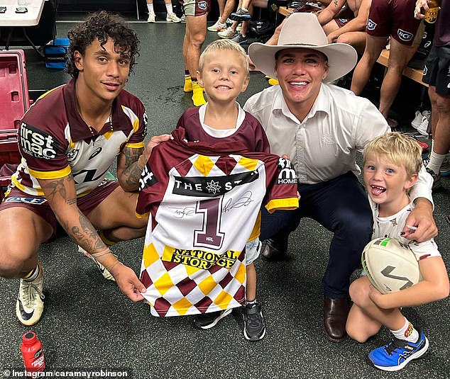 Clara Robinson explained that Max (pictured meeting the Broncos with his brother) needs treatment to tackle mutated cancer cells, which is not available in Australia