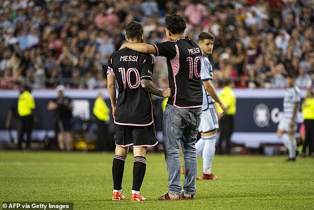 The fan reached Messi and appeared to try to take a selfie before Yassine Cheuko intervened