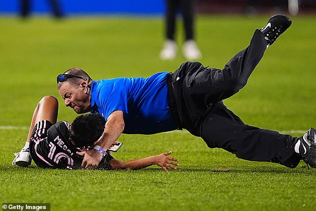 Another young fan, wearing a Messi jersey, was attacked by stadium security during the match