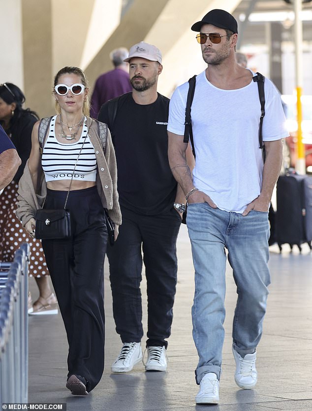 The couple, who traveled to the US last week, made a stylish arrival back Down Under as they walked side by side through the international arrivals terminal