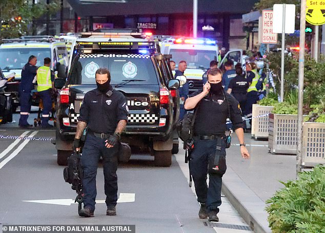 Police (pictured at the scene of Saturday's massacre) have said the two stabbing incidents are unrelated