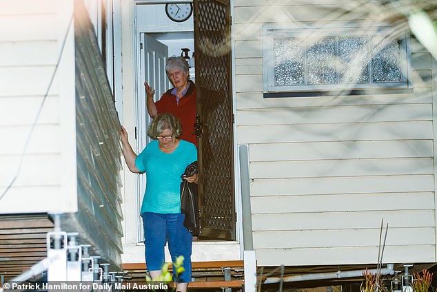 On Sunday evening, a neighbor who has lived on the street for more than 30 years visited Ms Cauchi (pictured in red top) for about an hour and said 