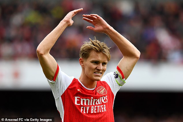 Martin Odegaard throws his hats into the air in frustration after his team suffered a defeat