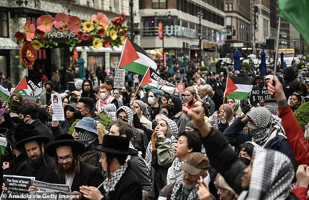 Rubio says the same call for an Israeli 'ceasefire' in Gaza is now celebrating Iran's attacks.  Pictured: Pro-Palestinian protesters rally in Herald Square, New York, on April 12, 2024