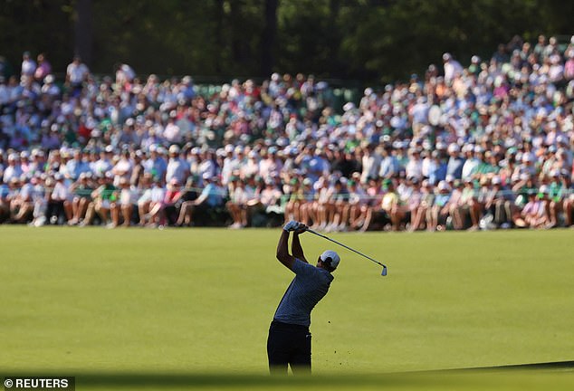 Aberg hits his approach shot on the 13th hole during the final round of The Masters