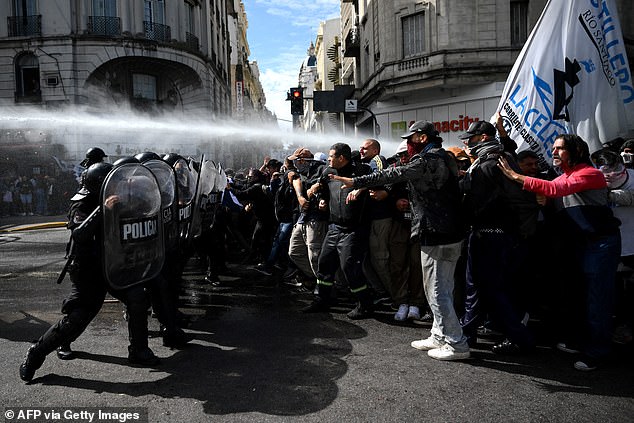 Members of social organizations clashed with police in Buenos Aires on Wednesday during a demonstration against recent economic measures introduced by President Javier Milei's government.  At least two police officers and a media worker were injured and eleven people were arrested