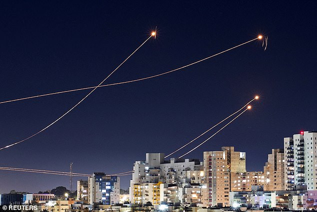 Pictured: An anti-missile system in Israel intercepting rockets launched from the Gaza Strip earlier this year