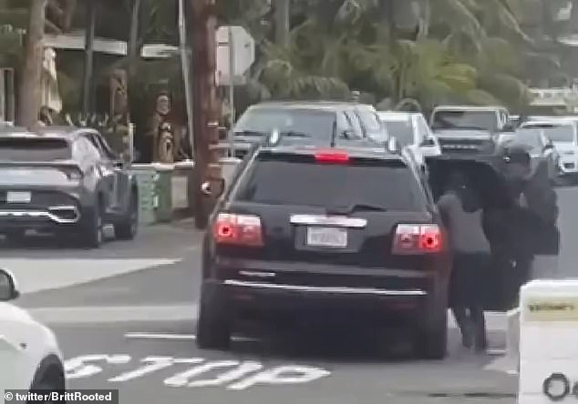 The cars took off in such a hurry that one woman almost fell out when the car started moving before she had fully climbed into the back seat.