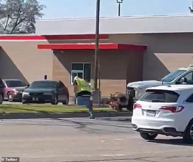 He and another man can be seen running across the road, away from the truck, which then collides with him